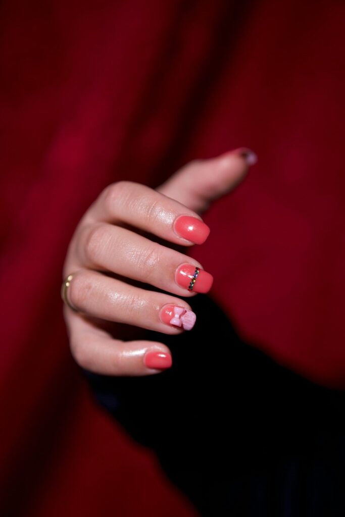 Cute Coral Short Nails with Bow Accent