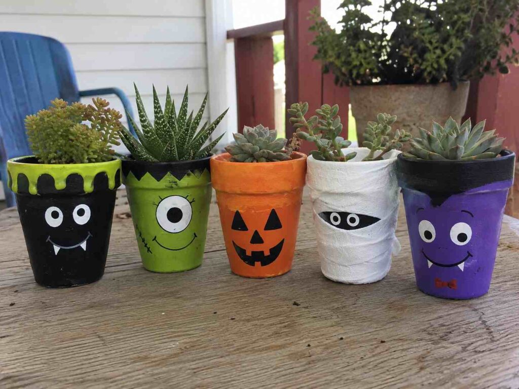 Easy Halloween Crafts to Make Your Home Feel Cozy & Magical 5 Halloween Painted Clay Pots