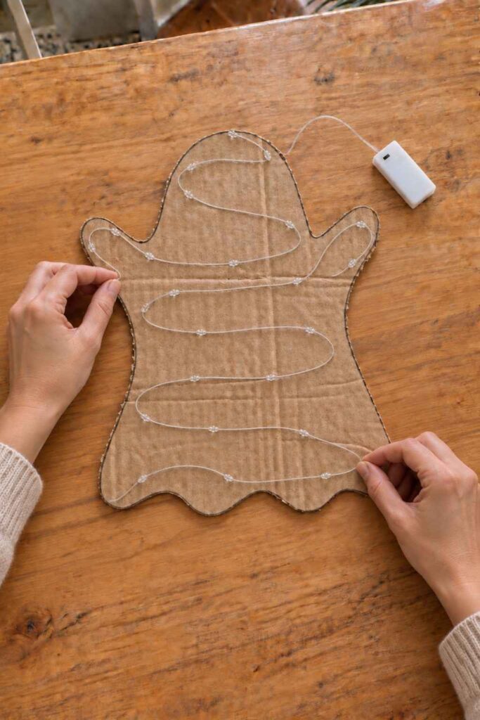 DIY Glowing Ghost Lamp for Easy Halloween Decor 6 Arrange the Fairy Lights