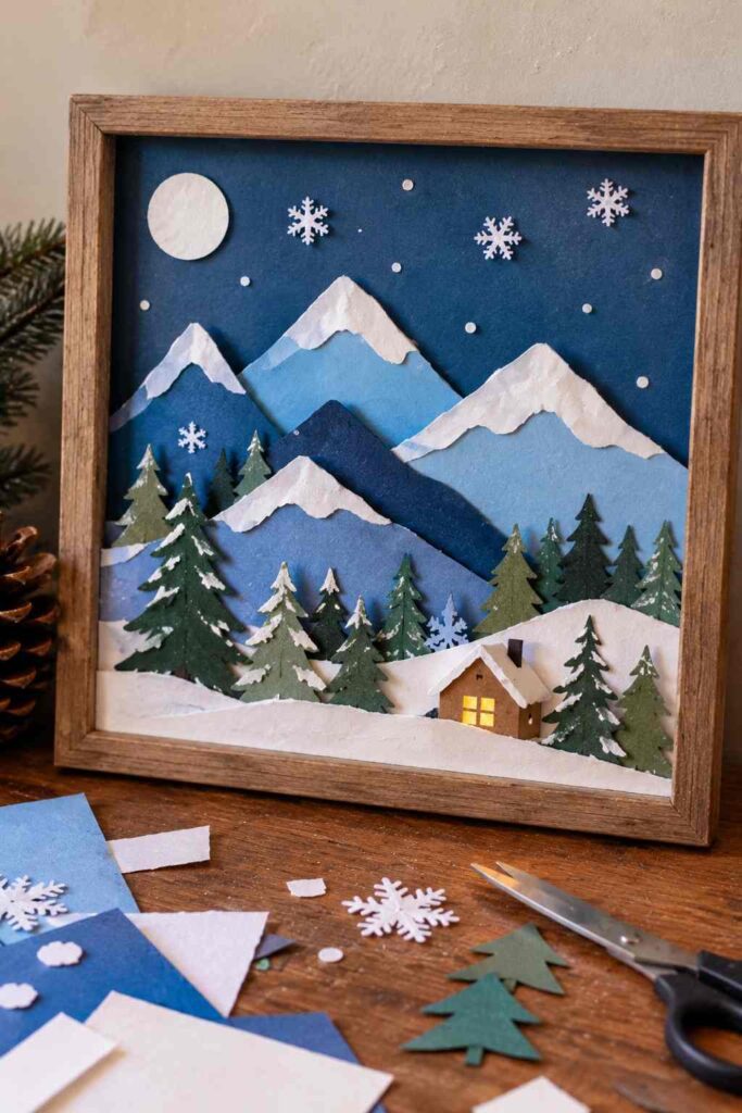 20 Easy Winter Paper Crafts to Make at Home (Fun & Simple Ideas) 12 ## 10. Layered Paper Winter Mountain Landscapes Create a peaceful winter landscape with layers of paper mountains, snowy peaks, and tiny evergreen trees. This simple craft makes lovely seasonal wall art. **Materials** - Blue, white, and green cardstock - Scissors and glue - Pencil - Cardstock for the background **How to Make It** 1. Cut blue and white paper into uneven mountain shapes. 2. Glue the largest mountains onto the background first. 3. Add smaller mountain layers in front to create depth. 4. Cut tiny green evergreen trees and glue them along the bottom. 5. Add white paper snowcaps and a few small snowflakes. **Tip:** Use different shades of blue to make your winter landscape look deeper and more interesting.