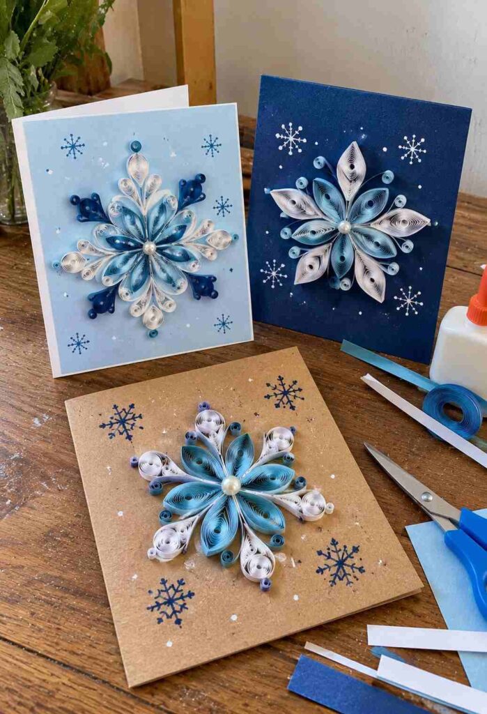 20 Easy Winter Paper Crafts to Make at Home (Fun & Simple Ideas) 13 ## 11. Quilled Paper Snowflake Greeting Cards Make delicate winter greeting cards with rolled paper strips arranged into snowflake patterns. These handmade cards are perfect for holiday greetings or a thoughtful winter surprise. **Materials** - White or light blue cardstock - Thin strips of colored paper - Glue - Scissors - Pencil and ruler **How to Make Them** 1. Fold cardstock in half to create a greeting card. 2. Roll thin paper strips around a pencil to make small loops. 3. Arrange the loops into a snowflake pattern on the card. 4. Glue the pieces in place, adding a small paper circle in the center. 5. Write a short winter greeting inside once the glue dries. **Tip:** Use white and icy blue paper for a simple, elegant snowflake design.