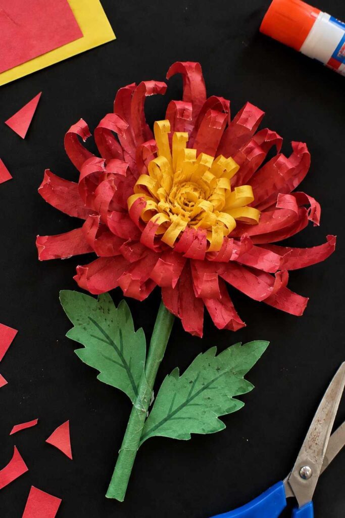 21 Easy & Creative Fall Crafts for Kids to Make at Home 5 Handmade Red and Yellow Paper Flower-